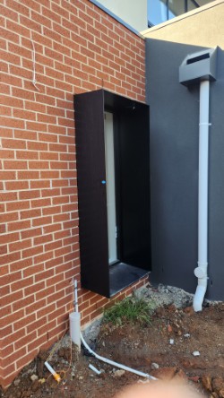 Black aluminium window shroud on red brick heritage home — eastern suburbs Melbourne