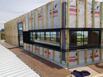 Commercial ribbon install of aluminium window shrouds — northern Melbourne